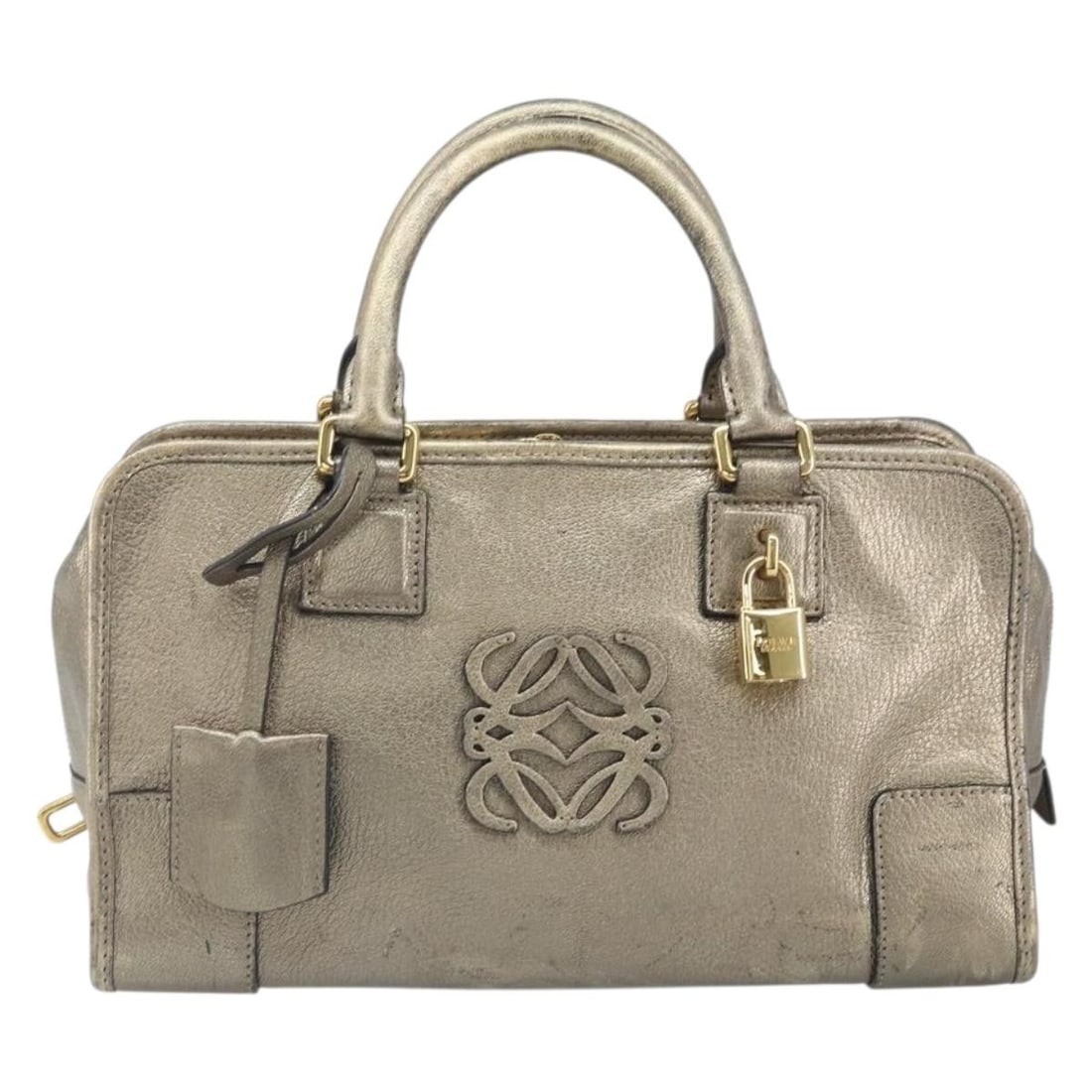 Loewe Amazona Gold Leather Handbag 28cm Spain: Loewe Amazona Gold Leather Handbag 28cm Spain This Loewe Amazona Bag is crafted from leather in a gold color, designed for women. The bag originates from Spain and features a structured silhouette. It