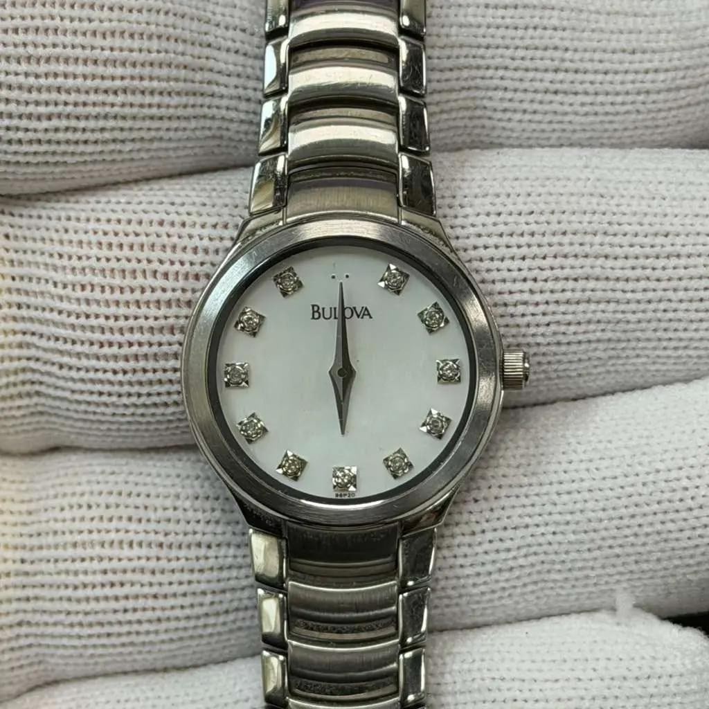 Bulova 96P20 Ladies Quartz Watch Diamond MOP Dial Stainless Steel: Bulova 96P20 Ladies Quartz Watch Diamond MOP Dial Stainless Steel The Bulova 23mm Stainless Steel White Mother of Pearl Diamond Dial Ladies Quartz Watch (Model: 96P20) combines elegance and functional