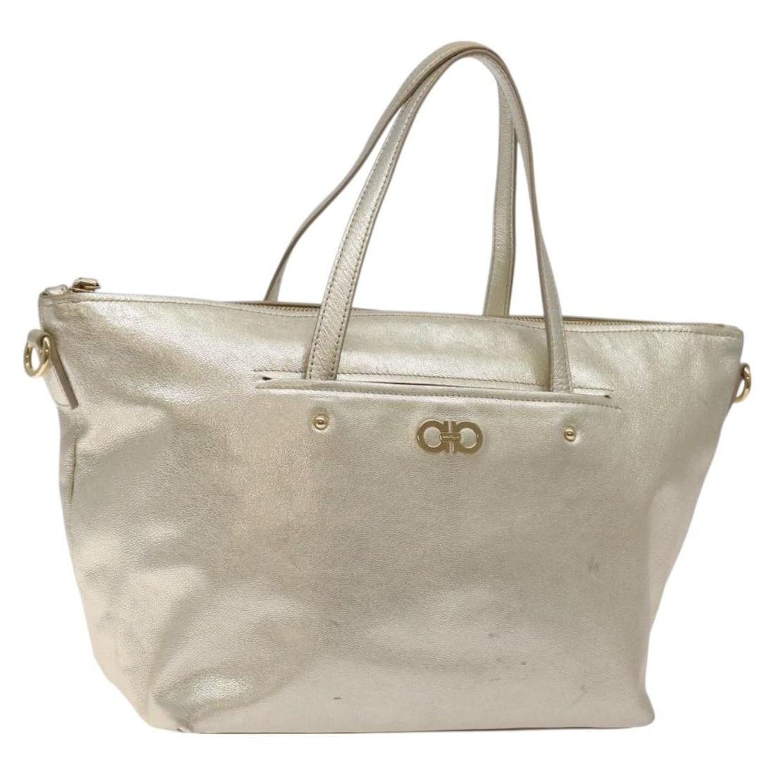 Leather Zip Tote Bag by Salvatore Ferragamo Vintage Model: Leather Zip Tote Bag by Salvatore Ferragamo Vintage Model This Salvatore Ferragamo Vintage Zip Tote is a leather handbag designed for women in a gold color. It features a zip closure and metal fitting