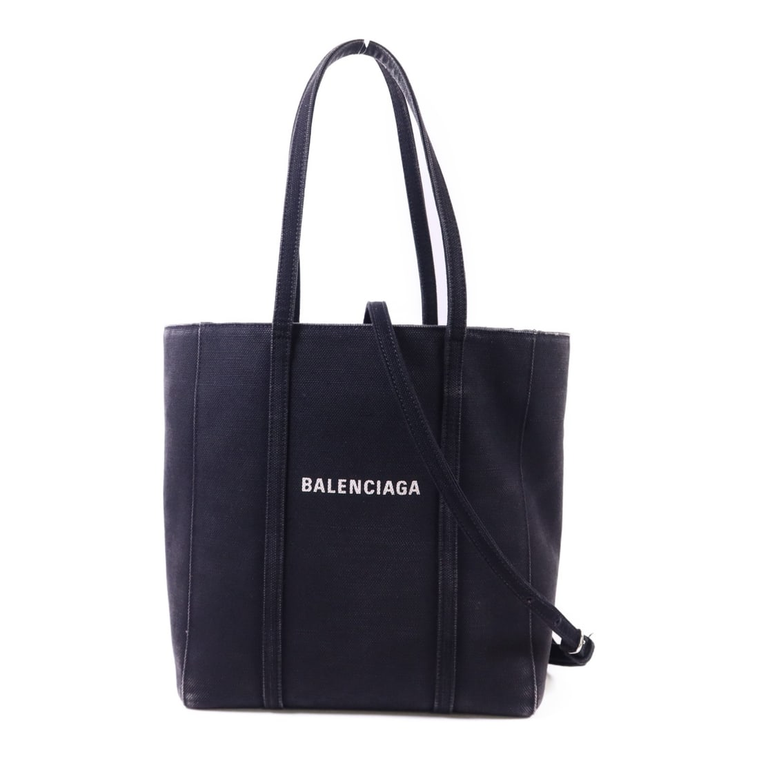 BALENCIAGA Everyday XS 2 Way Shoulder Bag Black Canvas: BALENCIAGA Everyday XS 2 Way Shoulder Bag Black Canvas Introducing the BALENCIAGA Everyday XS 2 Way Shoulder Bag, a stylish accessory crafted from durable black canvas. This versatile bag features a h