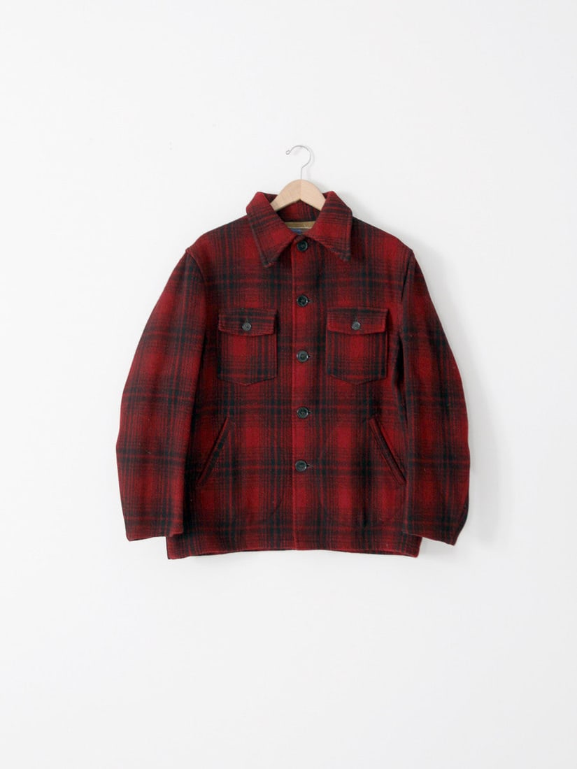 1930s H.W. Carter Wool Hunting Coat Red Plaid Vintage: 1930s H.W. Carter Wool Hunting Coat Red Plaid Vintage This vintage 1930s H.W. Carter and Sons hunting coat is a distinguished piece, crafted from heavyweight red and black plaid wool. The coat feature