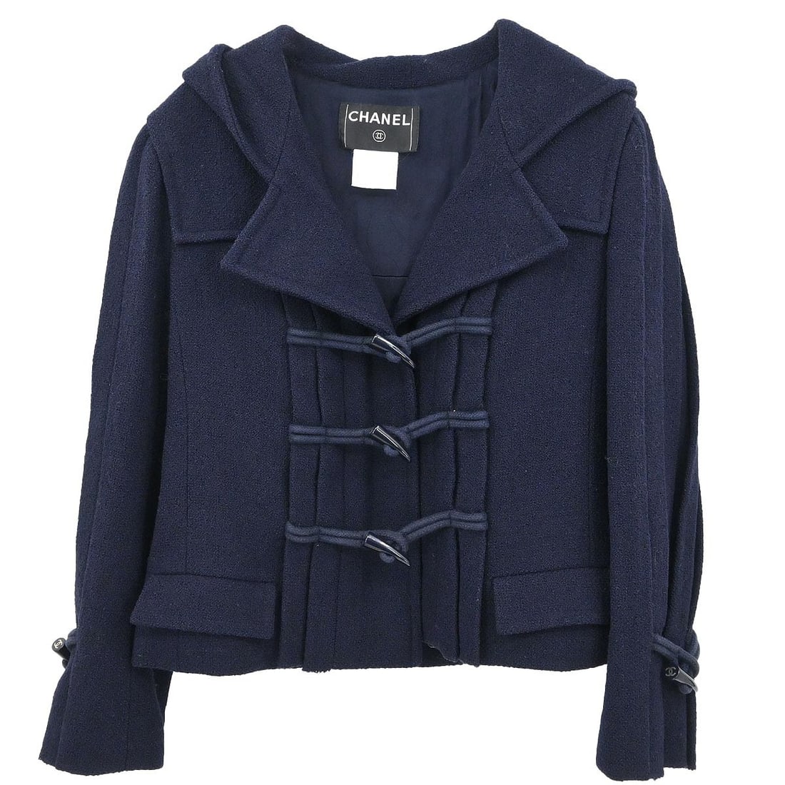 Navy Wool Hooded Toggle Jacket by Chanel Size 36: Navy Wool Hooded Toggle Jacket by Chanel Size 36 This Chanel navy duffel coat features a hooded single-breasted design with a toggle closure. Made from 100% wool, it offers a short length and long sle