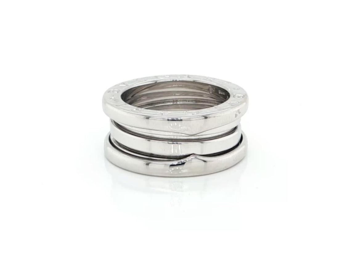 18k White Gold Bvlgari B.zero1 Triple Row Ring US 4.5 EU 49: 18k White Gold Bvlgari B.zero1 Triple Row Ring US 4.5 EU 49 This Bvlgari B.zero1 Three-Band ring is crafted in 18k white gold and features a high-polished finish. The iconic spiral design includes thr