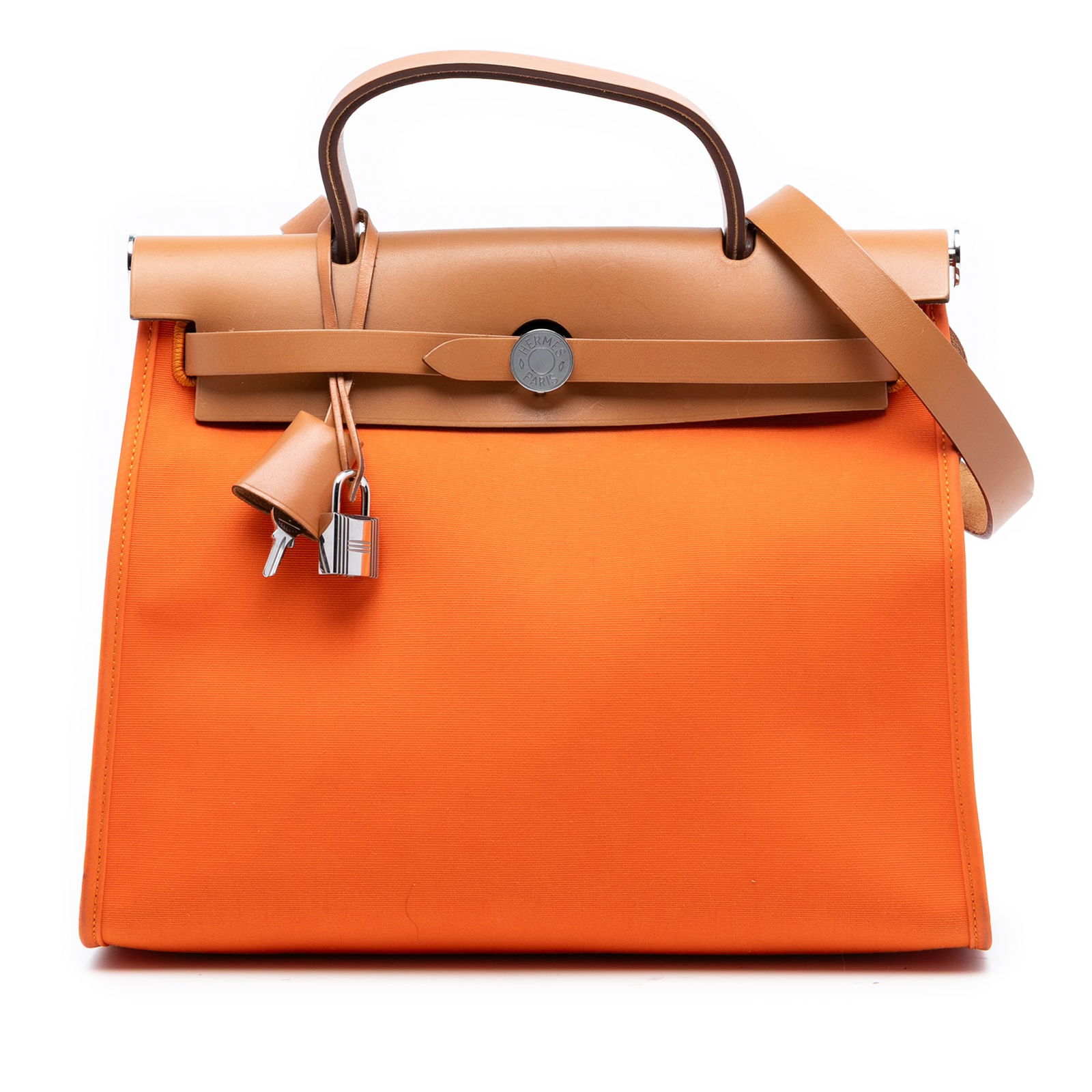Orange Herbag Zip 31 Canvas Bag with Leather Trim and Strap by Hermes: Orange Herbag Zip 31 Canvas Bag with Leather Trim and Strap by Hermes The Hermes Toile Herbag Zip 31 is crafted with a canvas body complemented by leather trim. It features a flat leather top handle,