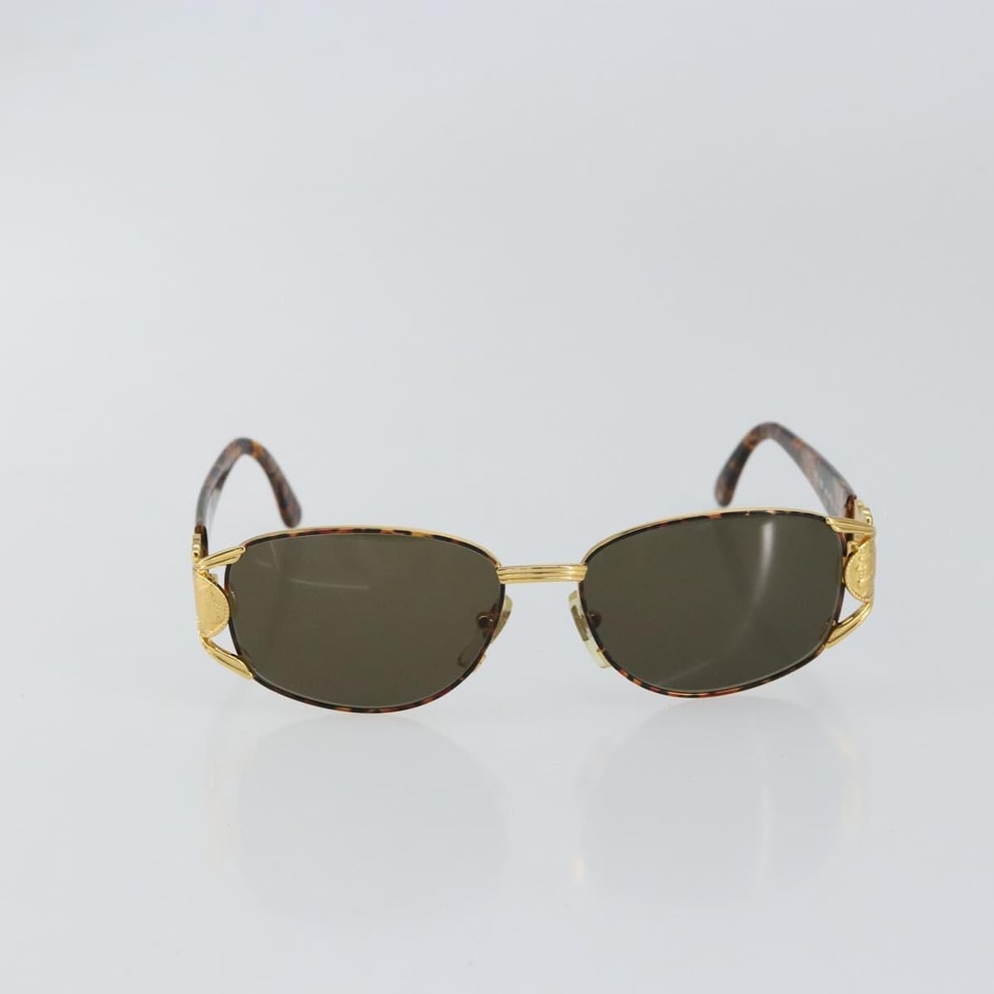 Fendi Gold Metal Sunglasses for Women: Fendi Gold Metal Sunglasses for Women This pre-owned pair of Fendi sunglasses features a gold metal frame designed for women. Made in Italy, the sunglasses are in very good condition with only slight