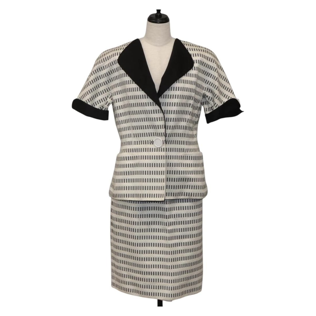 White Cotton Jacket by Christian Dior Authentic: White Cotton Jacket by Christian Dior Authentic This Christian Dior jacket features a classic design crafted from white cotton. The item shows reasonable wear and tear, including slight rubbing on the