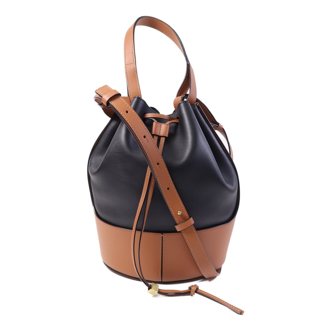 LOEWE Balloon Medium Brown Black Calfskin Two Way Shoulder Bag with Gold Hardware: LOEWE Balloon Medium Brown Black Calfskin Two Way Shoulder Bag with Gold Hardware This LOEWE Balloon Medium 2-way shoulder bag is crafted from calfskin leather in brown and black. The versatile design