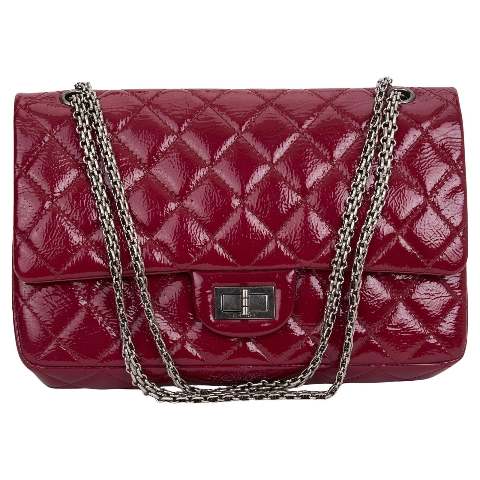Chanel 2.55 Jumbo Reissue Red Patent Leather Shoulder Bag: Chanel 2.55 Jumbo Reissue Red Patent Leather Shoulder Bag This Chanel 2.55 Jumbo Reissue shoulder bag is a classic piece made from vibrant red patent leather, enhanced with silver hardware. It feature