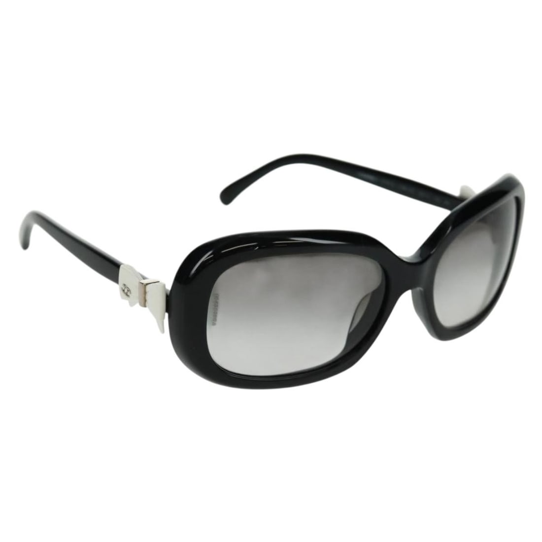 Black Plastic Sunglasses by CHANEL with CC Logo and Case: Black Plastic Sunglasses by CHANEL with CC Logo and Case These CHANEL sunglasses feature a classic black plastic frame with signature CC accents. Made in Italy, they are designed for both style and du