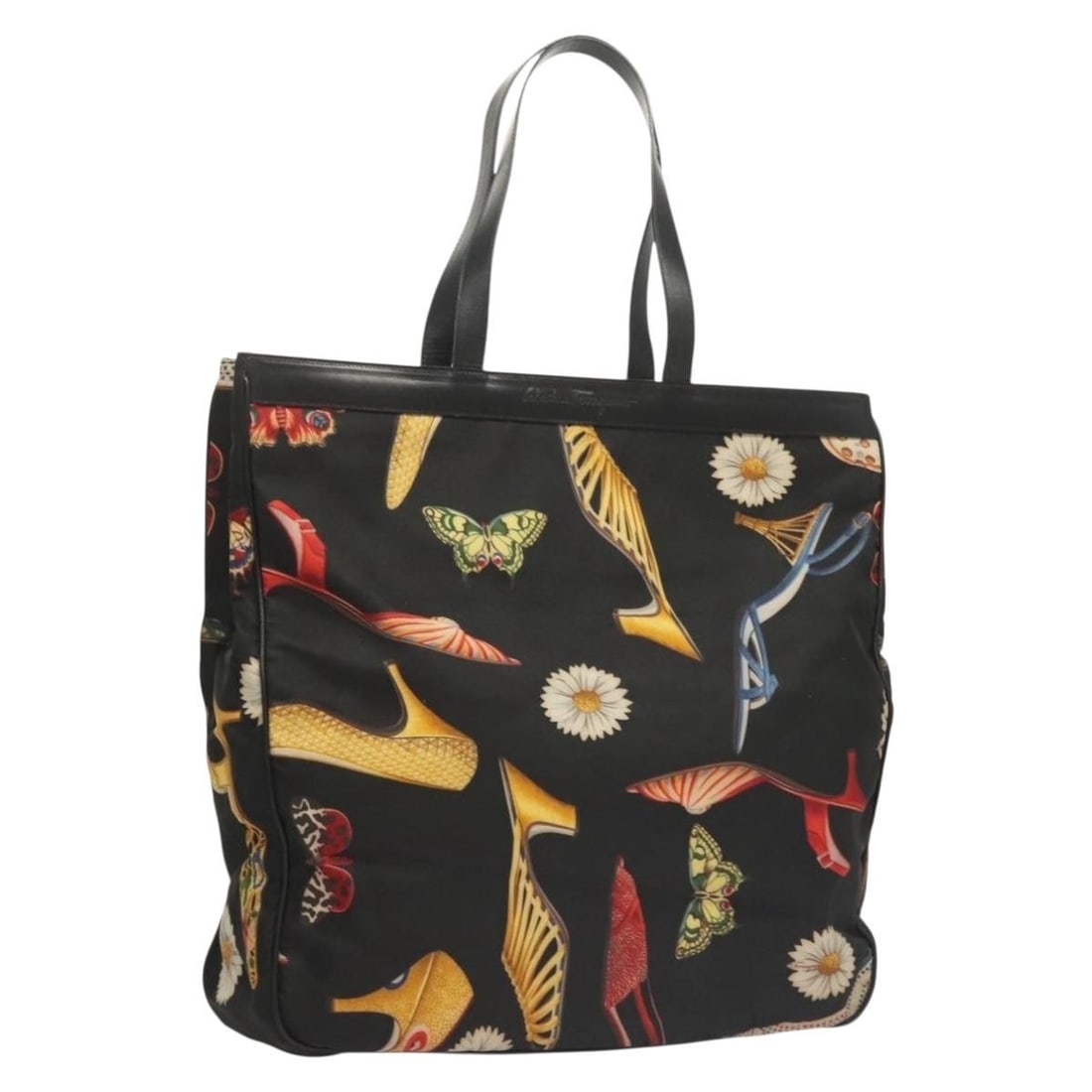 Canvas Salvatore Ferragamo Vintage Black Tote Bag from Italy: Canvas Salvatore Ferragamo Vintage Black Tote Bag from Italy This Salvatore Ferragamo vintage tote bag is crafted from black canvas and designed for women. It features a spacious interior, leather acc