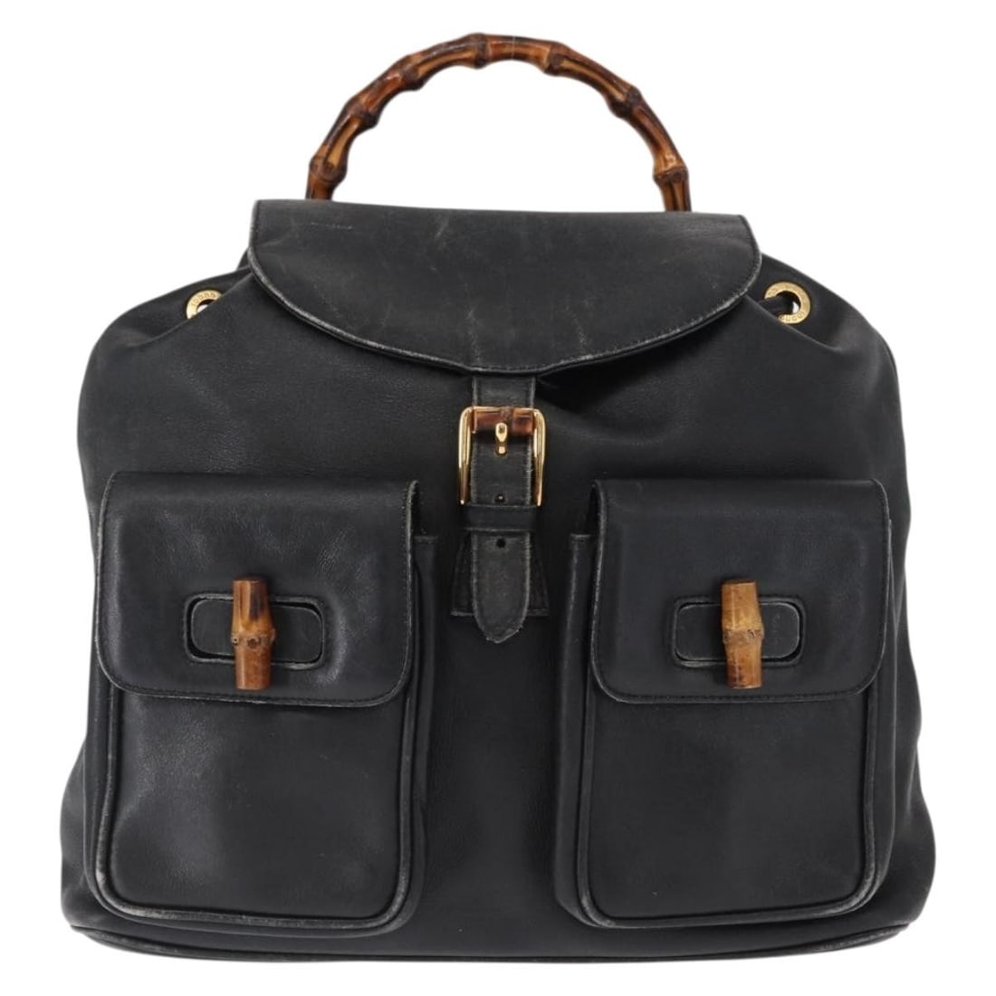 Vintage Gucci Leather Backpack with Bamboo Handle in Black: Vintage Gucci Leather Backpack with Bamboo Handle in Black This vintage Gucci Bamboo backpack in black leather is designed for women. It features a bamboo handle and shoulder straps, showing signs of