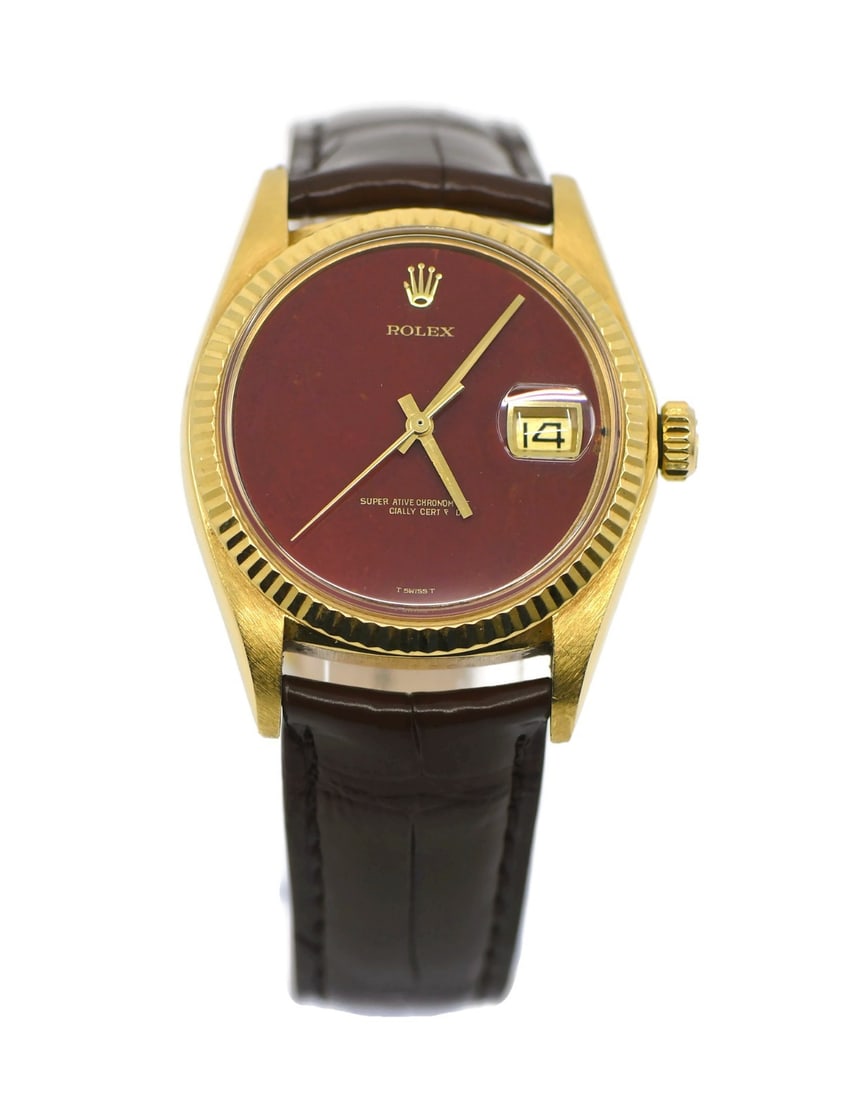 Rolex Oyster Perpetual 18K Yellow Gold Watch with Jasper Dial 1601: Rolex Oyster Perpetual 18K Yellow Gold Watch with Jasper Dial 1601 This exquisite Rolex Oyster Perpetual watch features a stunning original jasper stone dial in a striking red hue. Crafted from 18K ye