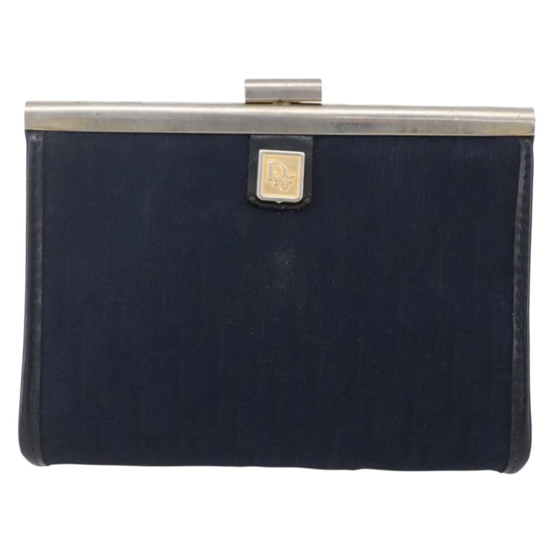 Navy Canvas Trotter Mini Pouch by Christian Dior: Navy Canvas Trotter Mini Pouch by Christian Dior This pre-owned Christian Dior Vintage Trotter Pouch is crafted from navy canvas and designed for women. It features a compact silhouette with metal fit