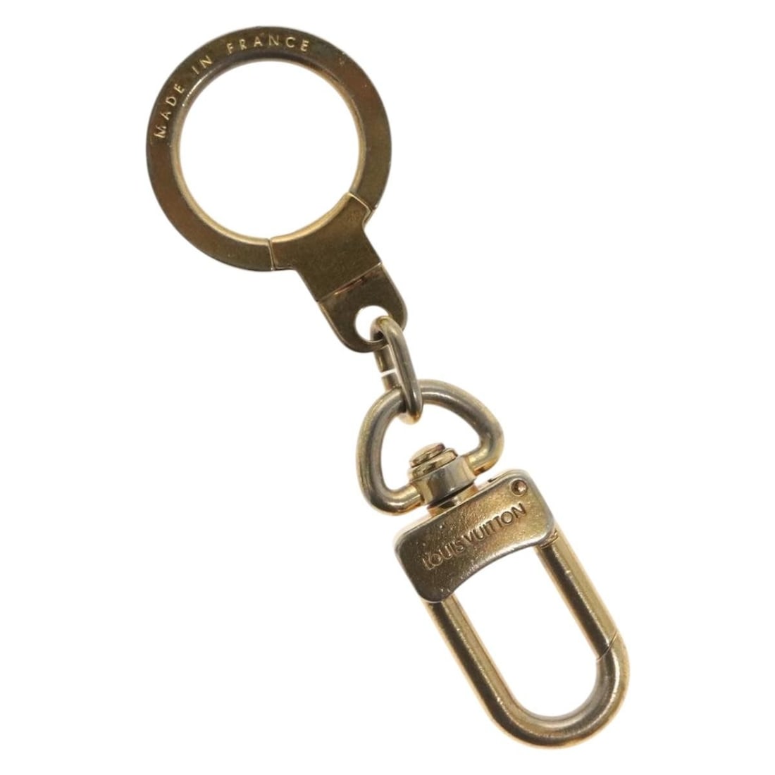 Metal Louis Vuitton Bolt Keychain Pochette Extender Gold Tone: Metal Louis Vuitton Bolt Keychain Pochette Extender Gold Tone Louis Vuitton Bolt Pochette Extender Keychain in gold metal, designed for unisex use. The keychain measures 8 cm in length and originates