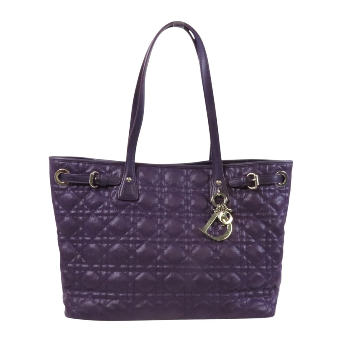 Dior Christian Dior Purple Calfskin Leather Tote Bag: Dior Christian Dior Purple Calfskin Leather Tote Bag This stylish Christian Dior Tote Bag showcases a luxurious design crafted from high-quality calfskin leather in a vibrant purple hue. With its spac