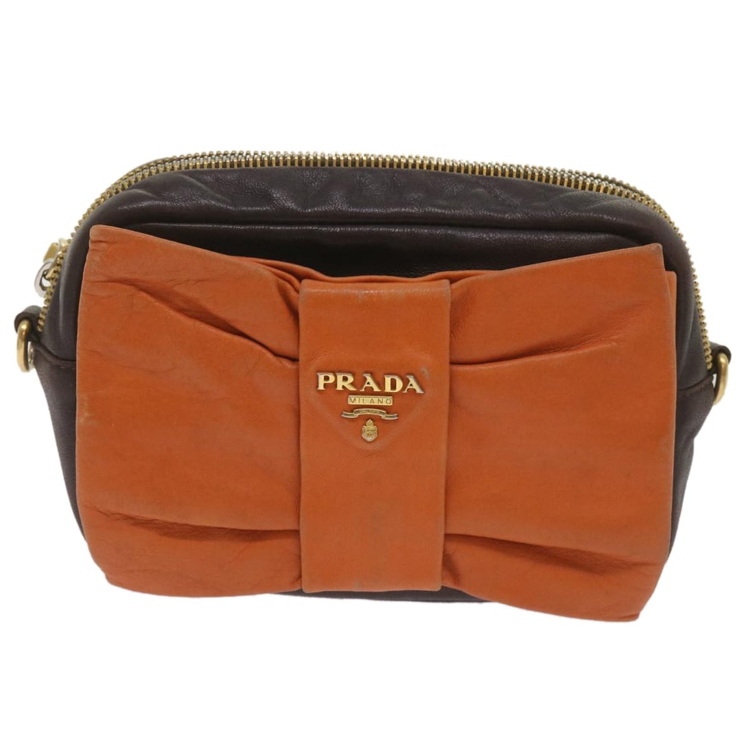 Orange Leather Prada Bow Camera Shoulder Bag for Women: Orange Leather Prada Bow Camera Shoulder Bag for Women This Prada Bow Camera shoulder bag is crafted from orange leather and designed for women. It features a compact silhouette with a bow detail and