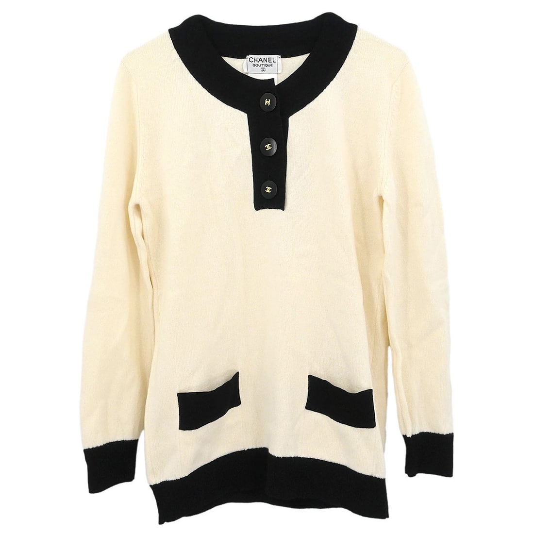 Vintage Chanel White Long Sleeve Cashmere Button-Up Top Size 44: Vintage Chanel White Long Sleeve Cashmere Button-Up Top Size 44 This vintage Chanel top features a classic button-up design crafted from 100% cashmere in an off-white shade. It has long sleeves, a rou