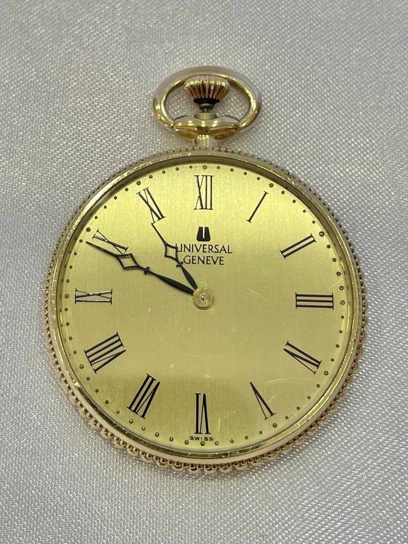 18K Yellow Gold Universal Geneve Pocket Watch Swiss Crafted: 18K Yellow Gold Universal Geneve Pocket Watch Swiss Crafted This exquisite pocket watch from Universal Geneve is crafted from 18K yellow gold, showcasing exceptional Swiss craftsmanship. The watch is