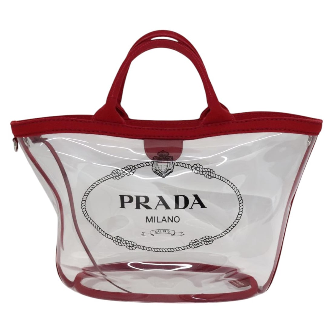 Transparent Plastic Prada Logo Tote Bag 27cm x 26cm x 18cm: Transparent Plastic Prada Logo Tote Bag 27cm x 26cm x 18cm This pre-owned Prada Logo Tote is crafted from transparent plastic and designed for women. It features the iconic logo and offers a spacious