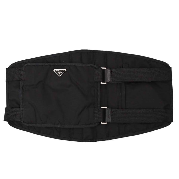 Prada Black Nylon Medium Belt Bag with Corset Waist Design V345Y: Prada Black Nylon Medium Belt Bag with Corset Waist Design V345Y This Prada black nylon corset waist belt bag features a medium-sized design with a prominent logo accent. Crafted from durable nylon, i