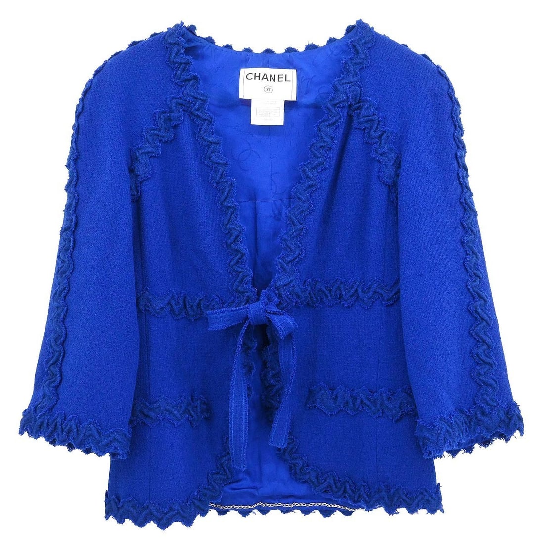 Blue Wool Nylon Chanel Jacket with Bow Accent Size 36: Blue Wool Nylon Chanel Jacket with Bow Accent Size 36 This Chanel collarless single-breasted jacket features a mid-length silhouette crafted from a blend of 84% wool and 16% nylon. Designed for a regu