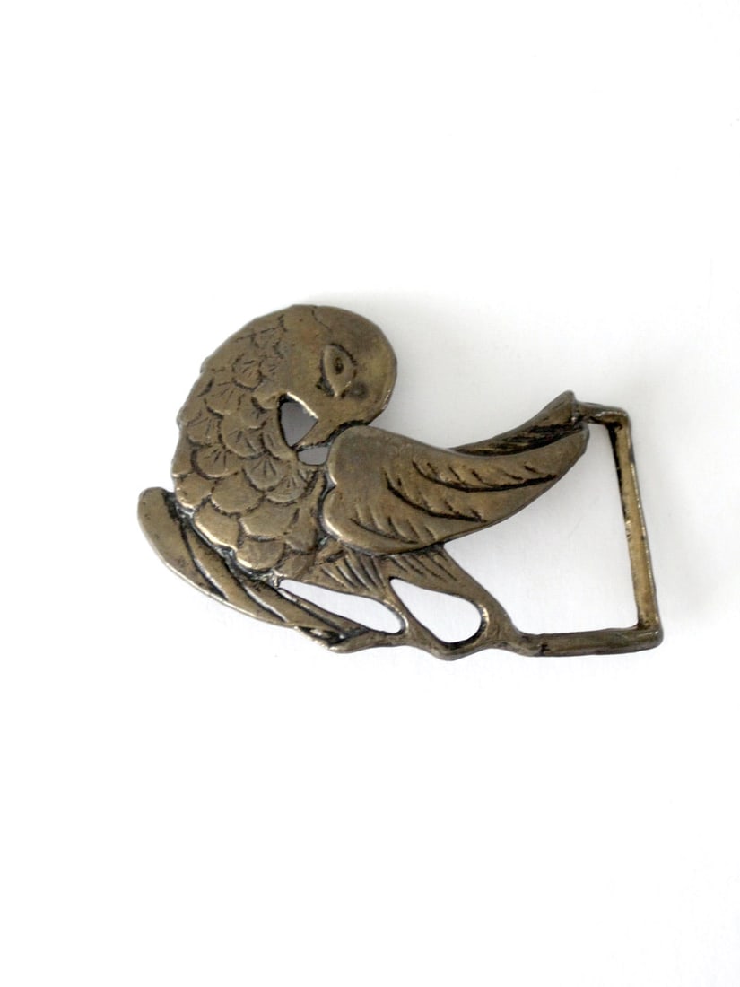 1960s Brass Bird Shape Belt Buckle Vintage Boho Accessory: 1960s Brass Bird Shape Belt Buckle Vintage Boho Accessory This is a vintage brass belt buckle from the 1960s, crafted in the shape of a bird. The large boho-style buckle features detailed design work