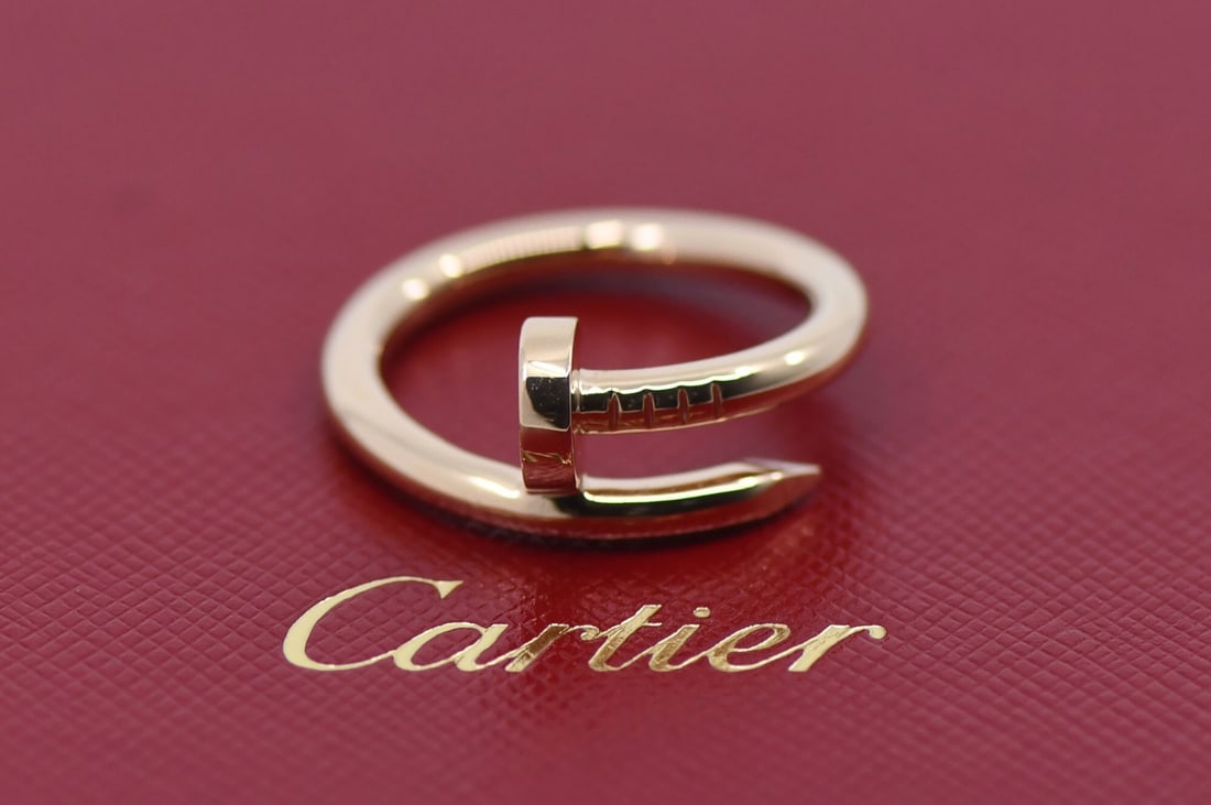 Juste un Clou Rose Gold 18k Ring by Cartier Size 57 with Box: Juste un Clou Rose Gold 18k Ring by Cartier Size 57 with Box This Cartier Juste un Clou ring is crafted from 18K rose gold and features a sleek, modern design inspired by the iconic nail motif. The ri