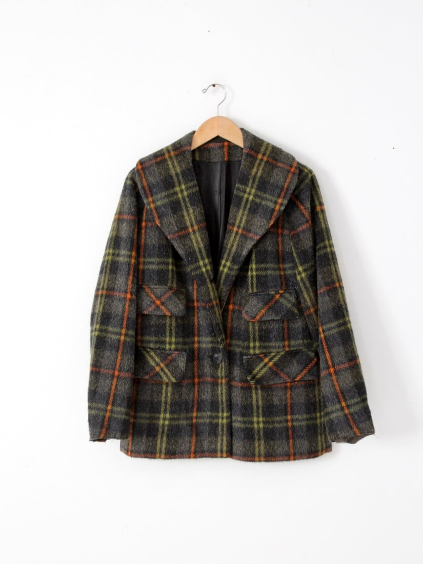 Vintage 1940s Wool Plaid Coat with Four Pockets: Vintage 1940s Wool Plaid Coat with Four Pockets This vintage wool plaid coat, dating back to the 1940s-1950s, showcases a stylish gray and black plaid pattern accented with yellow and green hues. It f