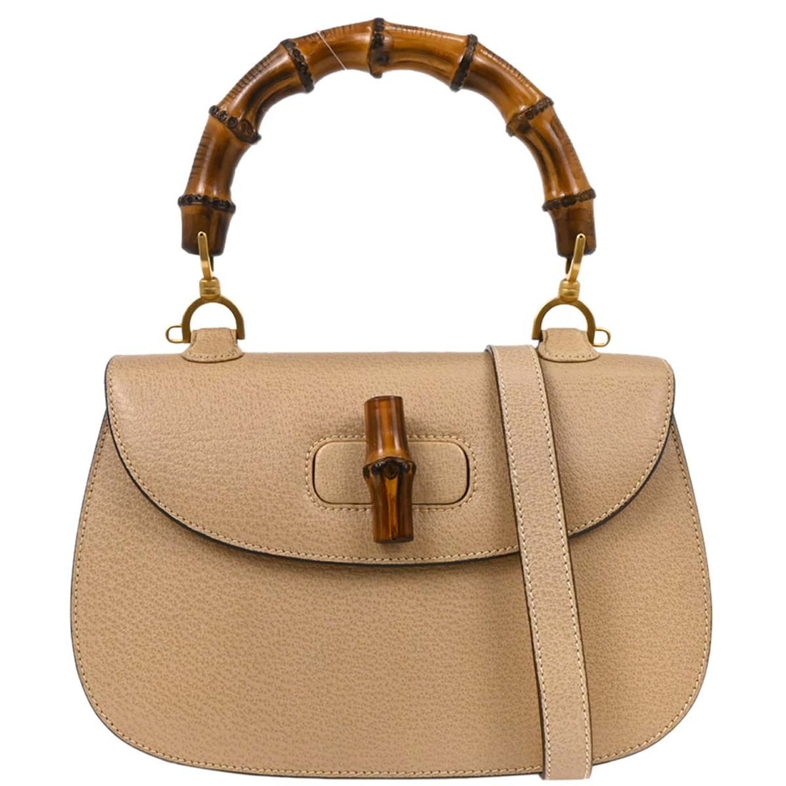 Gucci Leather Convertible Bamboo-Handled Vintage Purse: Gucci Leather Convertible Bamboo-Handled Vintage Purse This Gucci Vintage Convertible Bamboo Top Handle Bag is crafted from beige leather and designed for women. The bag features a distinctive bamboo