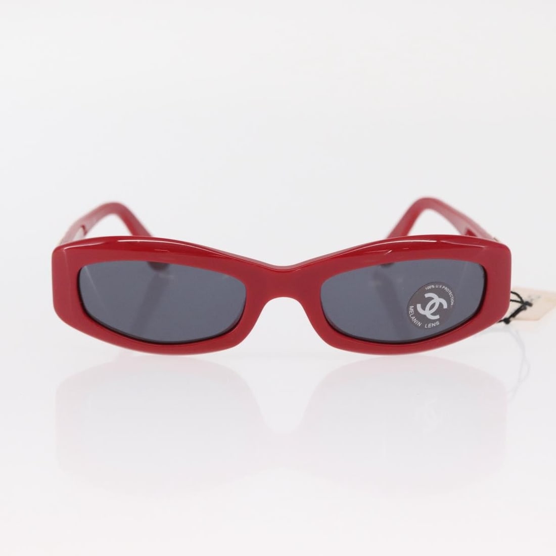 Red Plastic Chanel CC Logo Sunglasses for Women: Red Plastic Chanel CC Logo Sunglasses for Women These Chanel Logo CC sunglasses feature a bold red plastic frame and are designed for women. Made in Italy, they showcase the iconic Chanel logo and off