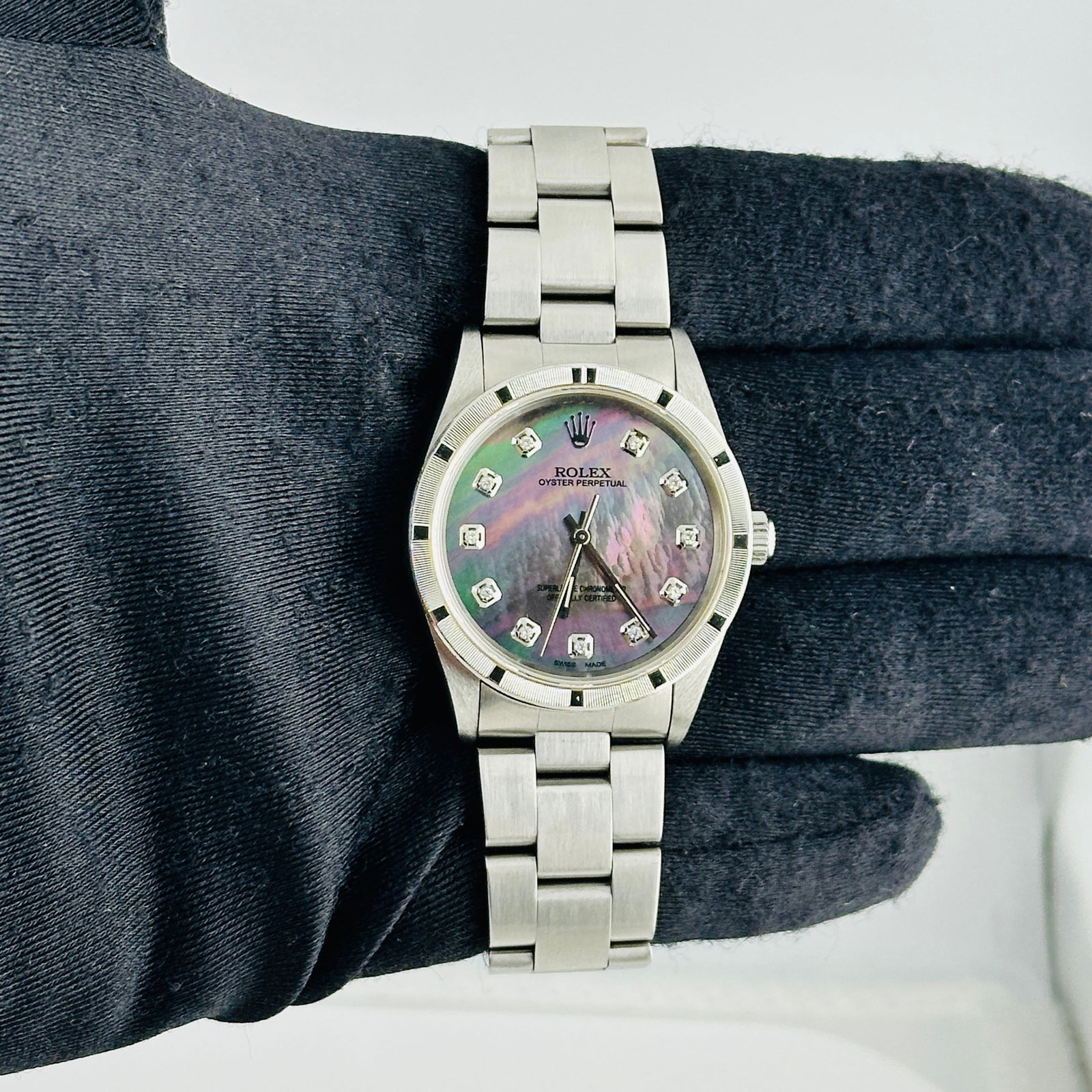 Unisex Oyster Bracelet Rolex Air-King 14010 Aftermarket Black MOP Dial Watch: Unisex Oyster Bracelet Rolex Air-King 14010 Aftermarket Black MOP Dial Watch This is a Rolex Air-King wristwatch featuring a black mother of pearl dial, an engine-turned bezel, and an Oyster bracelet.