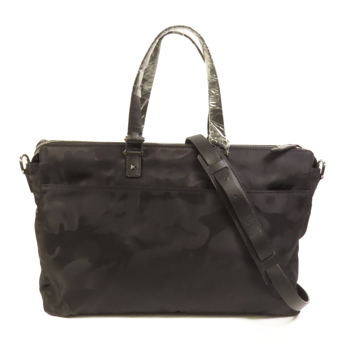 Valentino Black Nylon Camouflage Two Way Shoulder Bag: Valentino Black Nylon Camouflage Two Way Shoulder Bag This Valentino 2-way shoulder bag features a camouflage design and is crafted from durable black nylon. It offers versatile carrying options and c