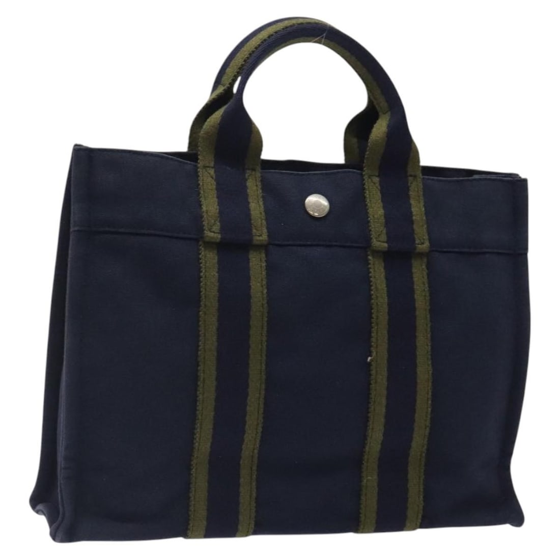 Navy Canvas Fourre Tout Tote by Hermes 30cm x 22cm x 8cm: Navy Canvas Fourre Tout Tote by Hermes 30cm x 22cm x 8cm Hermes Fourre Tout Tote in navy canvas featuring leather handles and metal fittings. This women's tote bag measures 30cm x 22cm x 8cm and was m