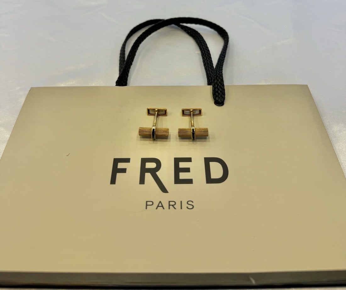 Fred 18K Yellow Gold Sapphire Cufflinks with Original Bag: Fred 18K Yellow Gold Sapphire Cufflinks with Original Bag This exquisite pair of cufflinks by French designer Fred showcases a stunning combination of 18k yellow gold and sapphire. Each cufflink featu