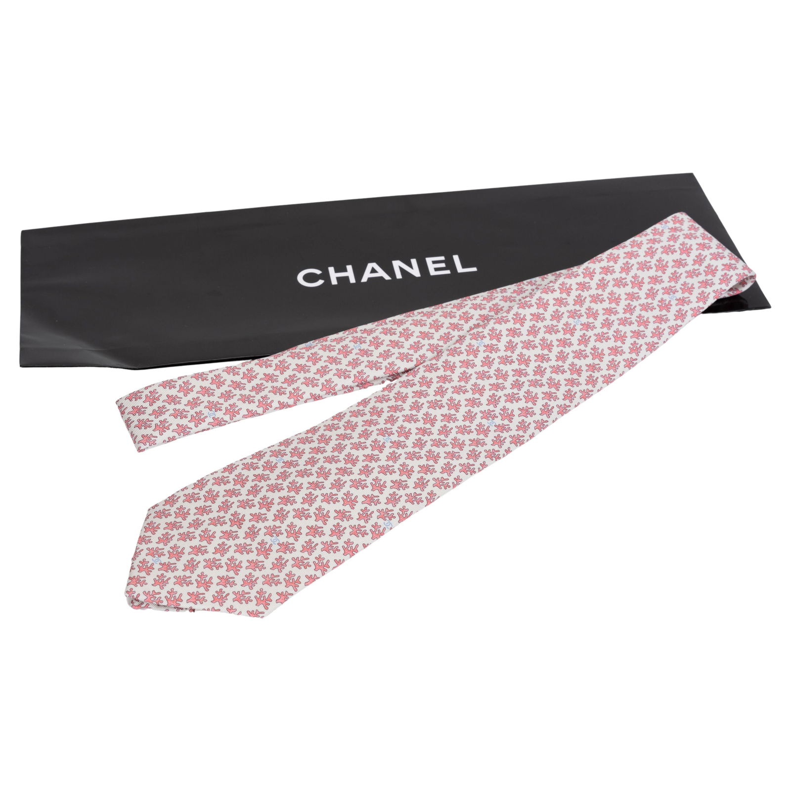 Chanel Coral Branch 100% Silk Tie with Original Envelope: Chanel Coral Branch 100% Silk Tie with Original Envelope Elevate your formal attire with this exquisite Chanel silk tie, featuring a vibrant cream and pink coral branch pattern. Crafted from 100% silk