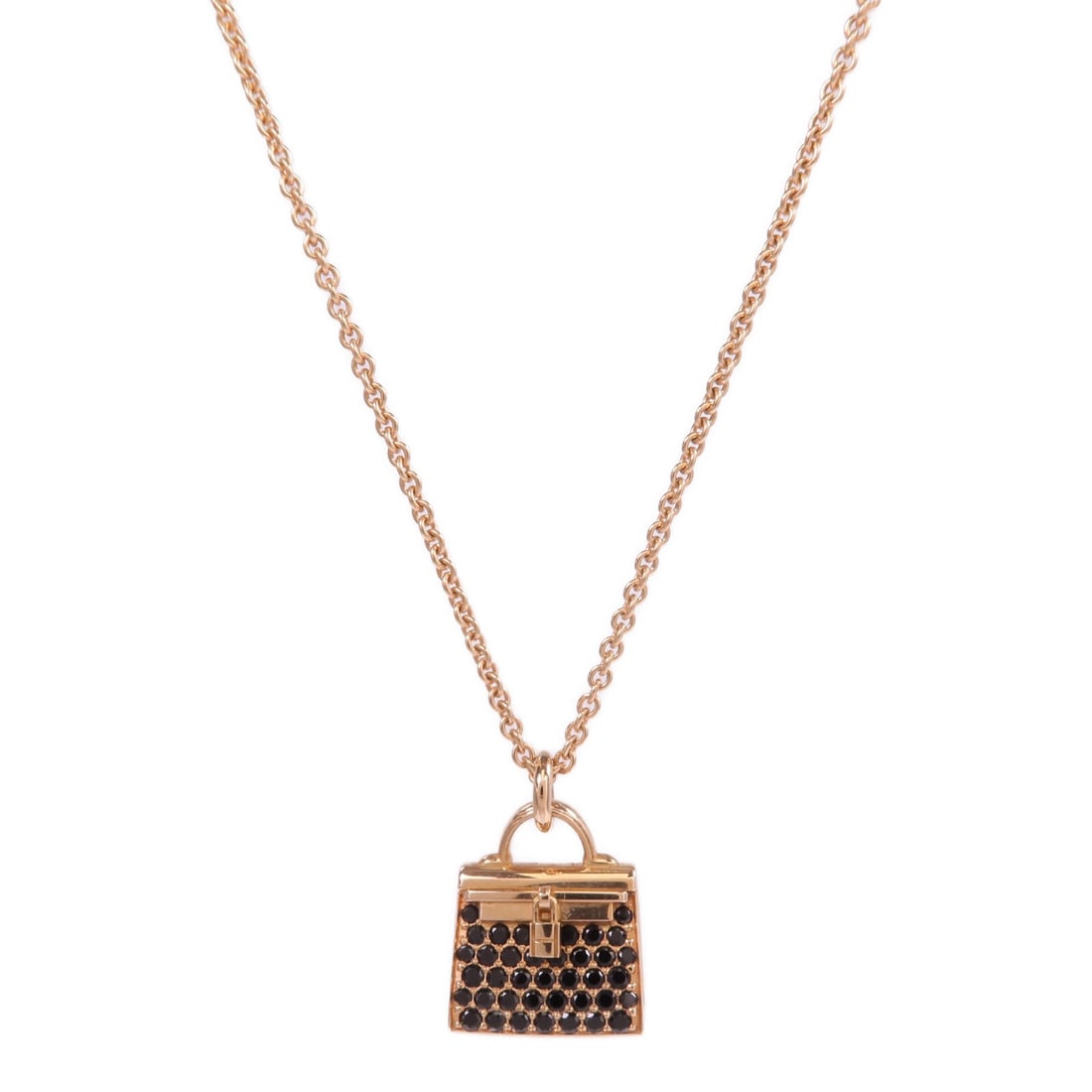 Hermes Kelly Amulettes Necklace in 18K Pink Gold with Blue Spinel: Hermes Kelly Amulettes Necklace in 18K Pink Gold with Blue Spinel This Hermes Amulettes Kelly pendant necklace features a blue spinel gemstone set in 18K pink (rose) gold. Crafted in France, it showca