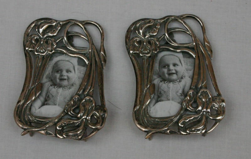 Set of Two Art Nouveau Sterling Silver Oval Photo Frames: Set of Two Art Nouveau Sterling Silver Oval Photo Frames This pair of Art Nouveau picture frames is crafted from sterling silver and features an elegant oval shape. Each frame is fully hallmarked with