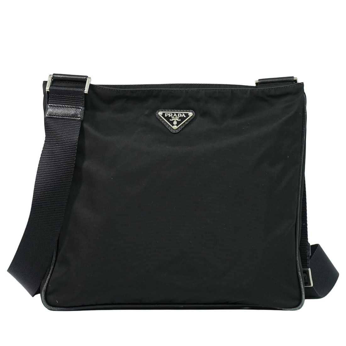 Prada Black Nylon Flat Messenger Unisex Bag Italy 29cm: Prada Black Nylon Flat Messenger Unisex Bag Italy 29cm This Prada Flat Messenger Bag is crafted from durable black nylon and features a practical unisex design. Made in Italy, the bag displays signs o