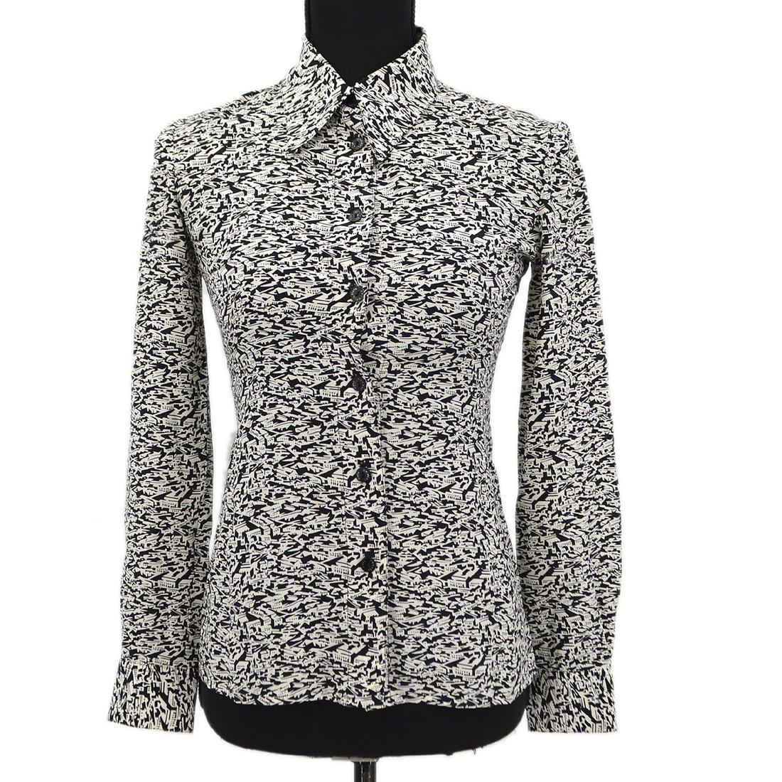 Vintage Chanel Black White Silk Long Sleeve Shirt 03C #34: Vintage Chanel Black White Silk Long Sleeve Shirt 03C #34 Discover this vintage Chanel long sleeve shirt in a classic black and white color scheme. Featuring a button closure and a collared neckline,