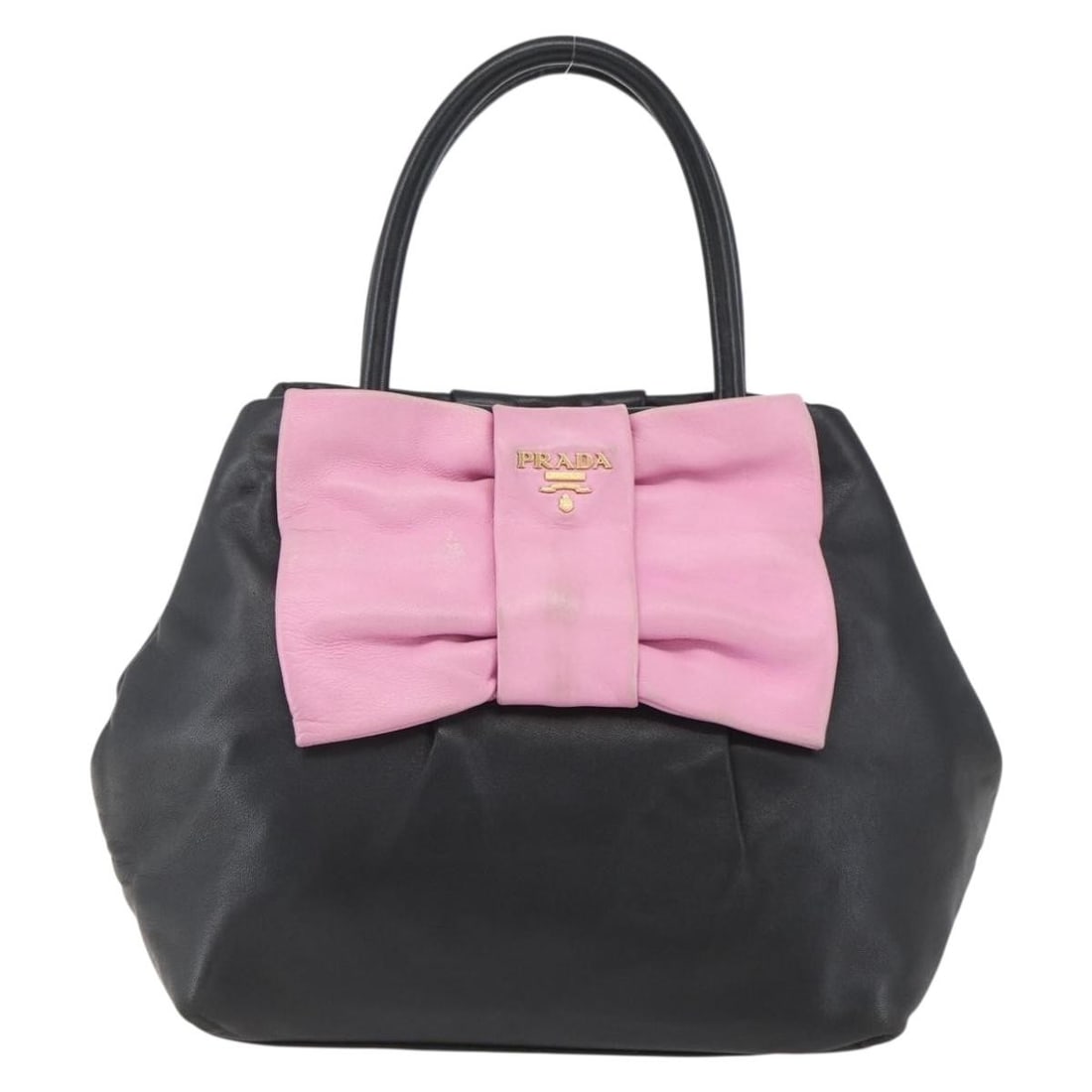 Black Leather Bow Tote by Prada 21cm x 20cm x 14cm: Black Leather Bow Tote by Prada 21cm x 20cm x 14cm This Prada Bow Tote is crafted from black leather and features a stylish design suitable for women. Made in Italy, the tote displays the signature bo