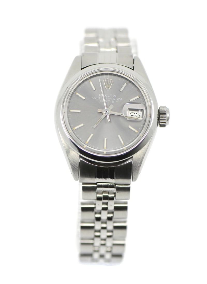 Rolex Oyster Perpetual Date 6916 Automatic Stainless Steel Wristwatch: Rolex Oyster Perpetual Date 6916 Automatic Stainless Steel Wristwatch This Rolex Oyster Perpetual Date wristwatch features a 26mm stainless steel case, a stainless steel band, and a gray analog dial.