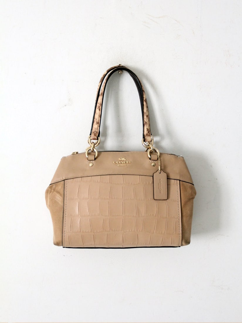 Coach Brooke Carryall Bag Embossed Leather Suede Snake Print: Coach Brooke Carryall Bag Embossed Leather Suede Snake Print Experience the elegance of the Coach Brooke Carryall Bag, a standout piece from Coach's early 2010s collection. This sophisticated bag feat