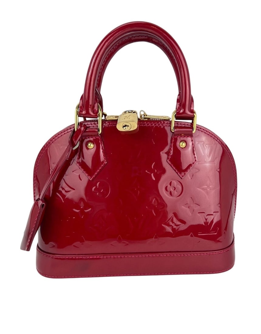 Louis Vuitton Alma BB Red Vernis Patent Leather Crossbody Bag: Louis Vuitton Alma BB Red Vernis Patent Leather Crossbody Bag Introducing the Louis Vuitton Alma BB Crossbody Bag, a timeless piece crafted from vibrant red vernis patent leather, featuring the iconic