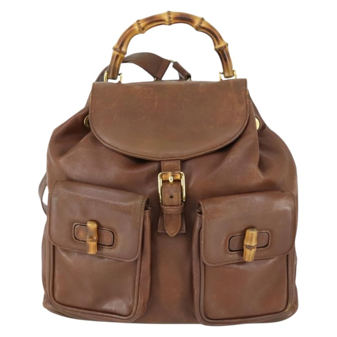 Gucci Leather Vintage Bamboo Backpack Brown 30cm by 28cm by 9cm: Gucci Leather Vintage Bamboo Backpack Brown 30cm by 28cm by 9cm This Gucci vintage bamboo backpack for women features brown leather construction with a distinctive bamboo handle. It shows signs of wea