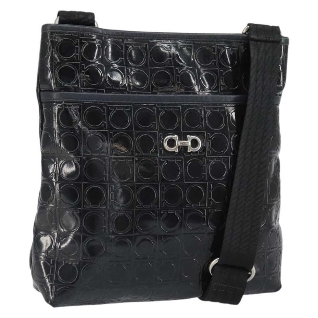 Black Patent Leather Shoulder Bag by Salvatore Ferragamo Silver Accents: Black Patent Leather Shoulder Bag by Salvatore Ferragamo Silver Accents This Salvatore Ferragamo shoulder bag features black patent leather with silver-tone accents. The bag offers a sleek and structu