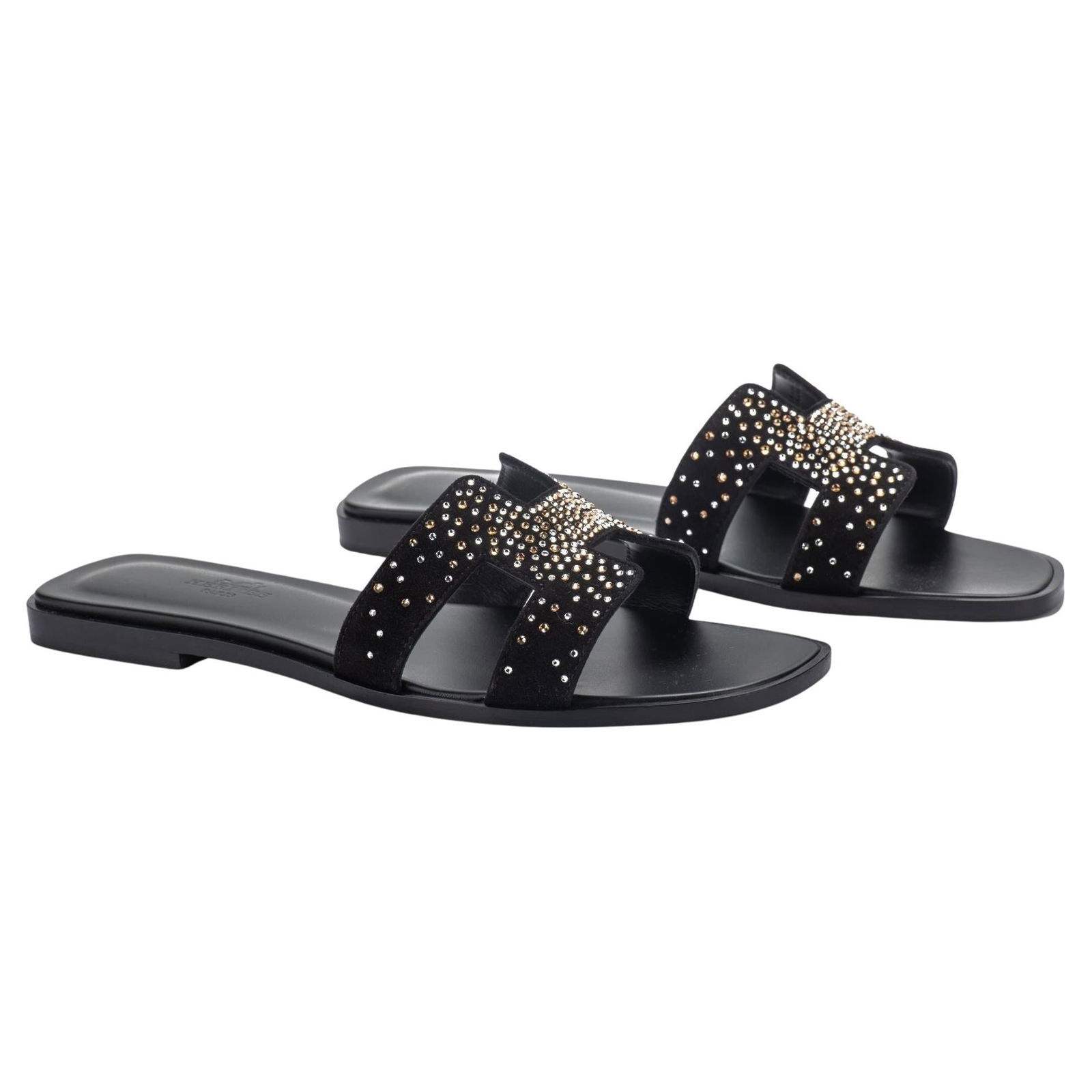 Hermes Limited Edition Black Rhinestone Oran Sandals N. 38: Hermes Limited Edition Black Rhinestone Oran Sandals N. 38 Discover the elegance of these limited edition Hermes sandals, crafted in luxurious black goatskin suede. Featuring a stunning rhinestone H d