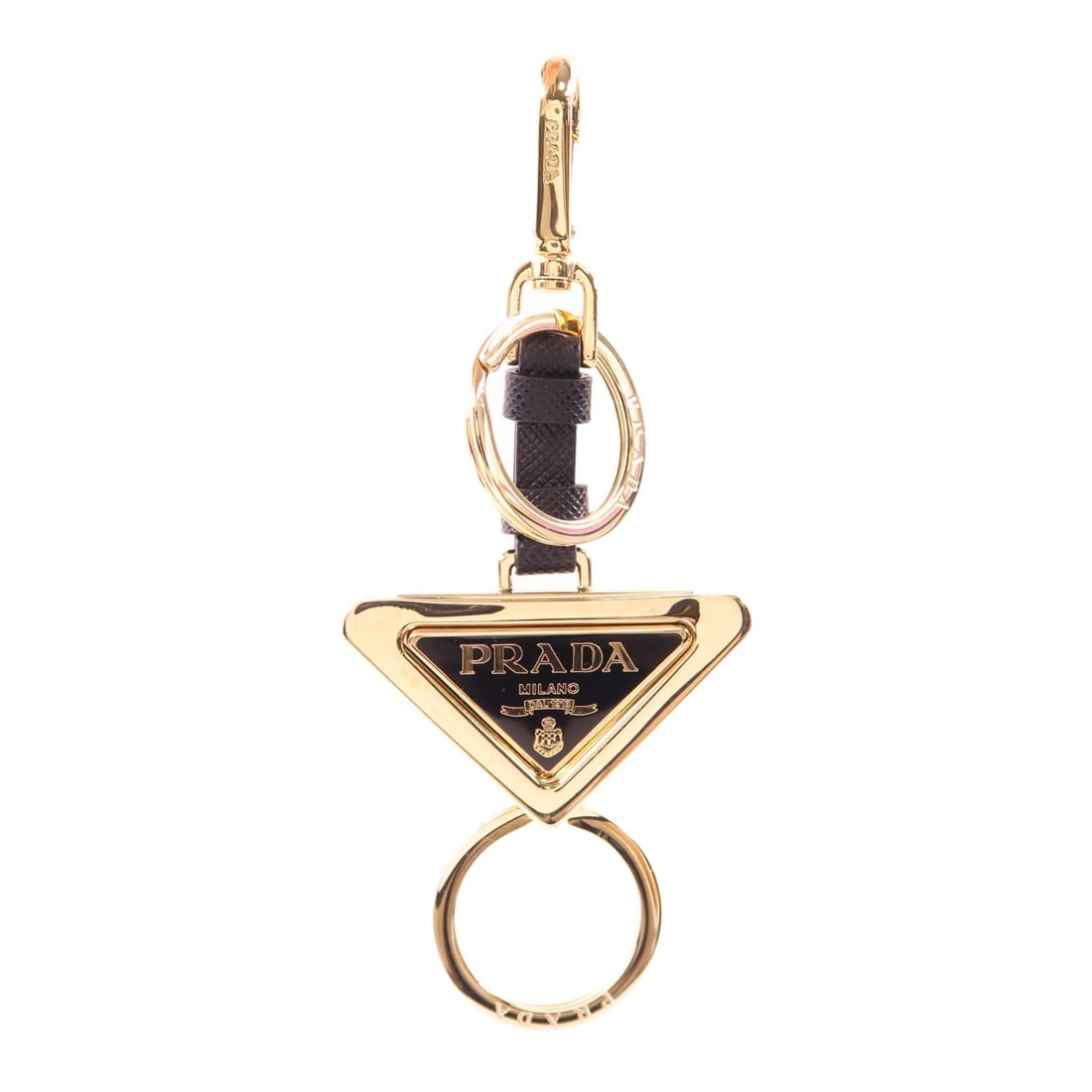 PRADA Triangle Logo Keychain Leather Black Gold 1PS059 66A/F019F: PRADA Triangle Logo Keychain Leather Black Gold 1PS059 66A/F019F Elevate your accessory game with this PRADA Triangle Logo Keychain. Crafted from high-quality leather, this stylish key ring features a