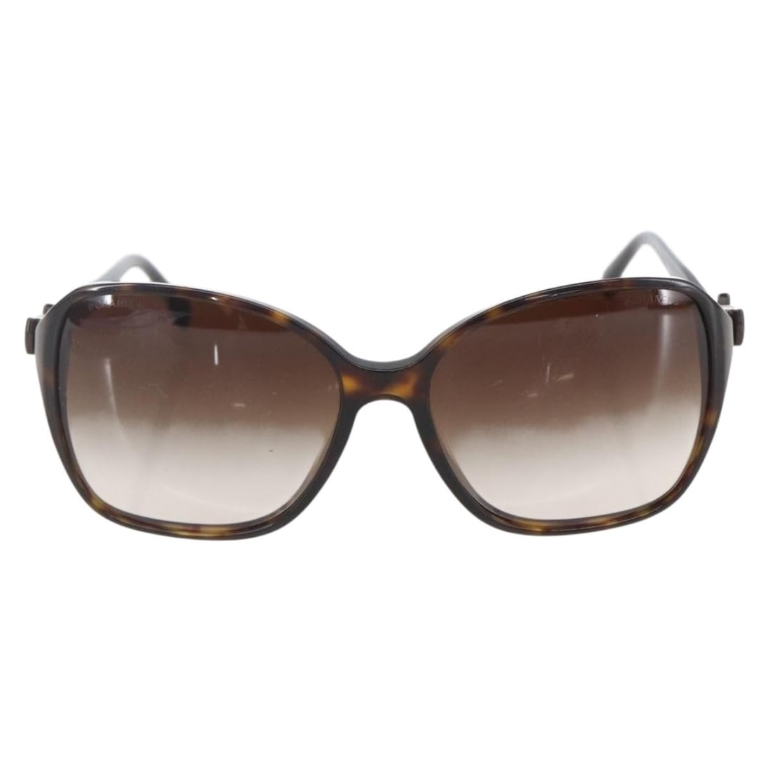 Chanel Plastic Brown Sunglasses with CC Logo for Women: Chanel Plastic Brown Sunglasses with CC Logo for Women Chanel Logo CC sunglasses designed for women in brown plastic. These sunglasses feature the iconic CC logo and are crafted in Italy. They exhibit