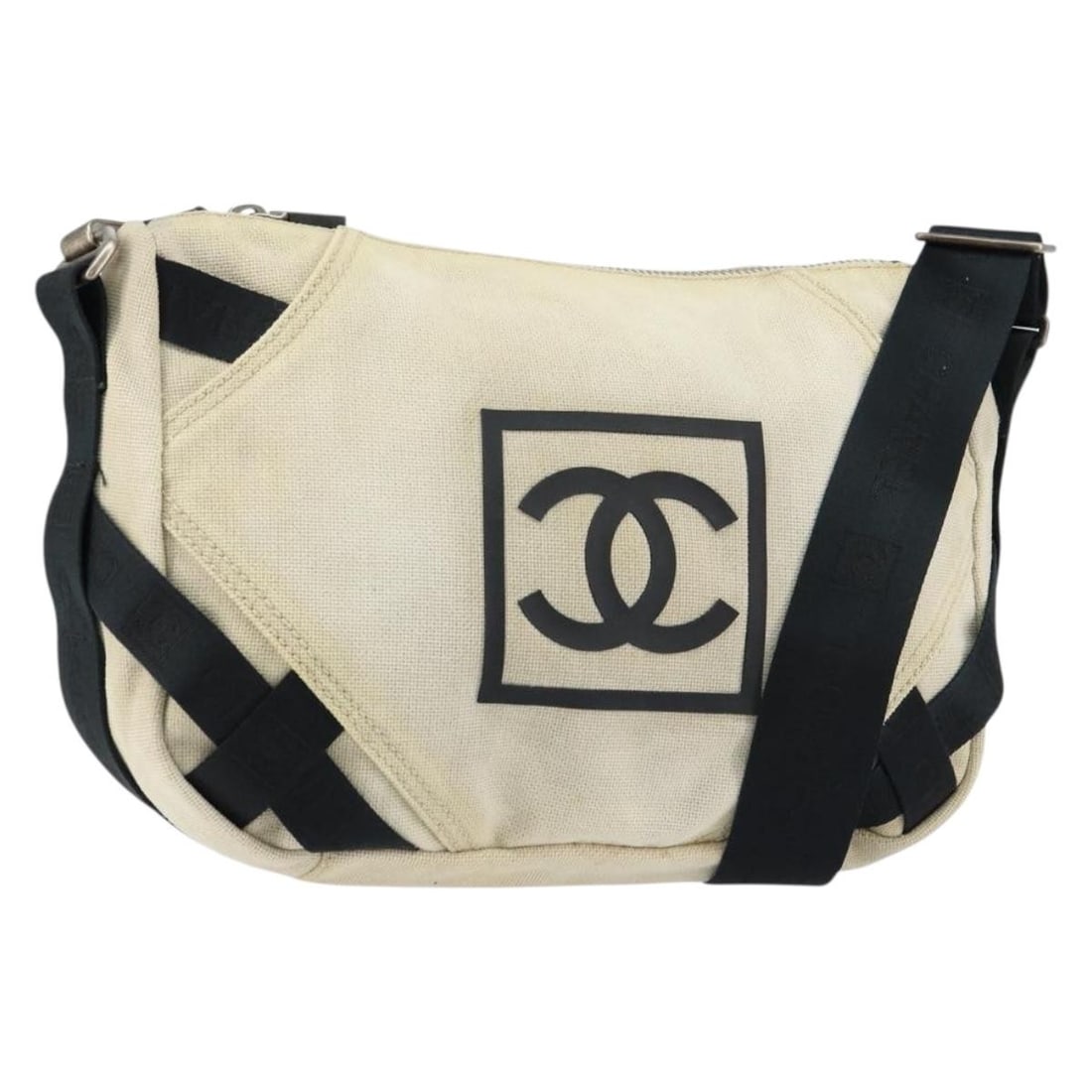 Beige Canvas Chanel Shoulder Bag Sports Style 29cm by 22cm by 12cm: Beige Canvas Chanel Shoulder Bag Sports Style 29cm by 22cm by 12cm This pre-owned Chanel Sports shoulder bag for women features beige canvas material and a spacious design. It shows signs of use inclu