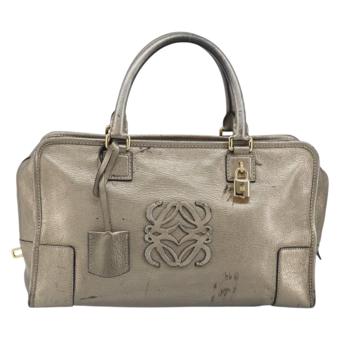 Gold Leather Handbag Loewe Amazona 36cm x 20cm x 13cm: Gold Leather Handbag Loewe Amazona 36cm x 20cm x 13cm This Loewe Amazona bag is crafted from leather in a gold color, designed for female use. It features metal fittings and multiple pockets. The bag